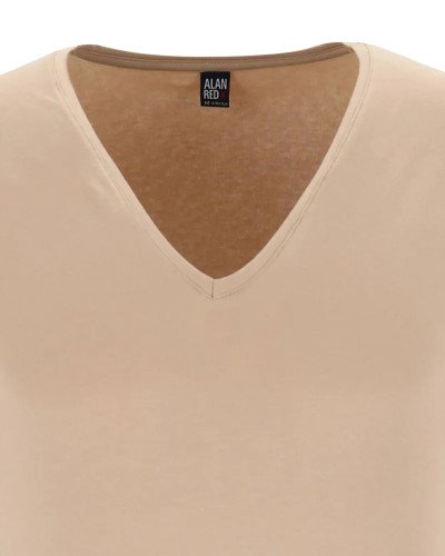 Deep V-neck detail of the men's skin-tone NOV T-shirt by Alan Red