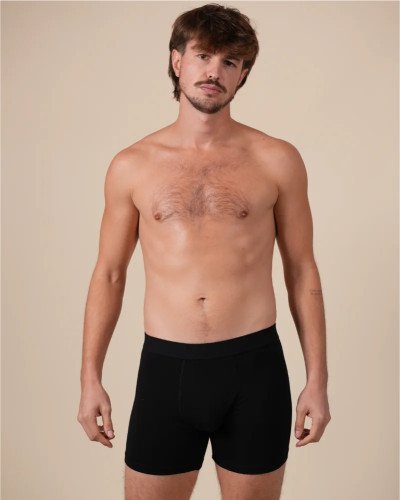 Full-length model wearing the Alan Red Bomber men's black boxer briefs