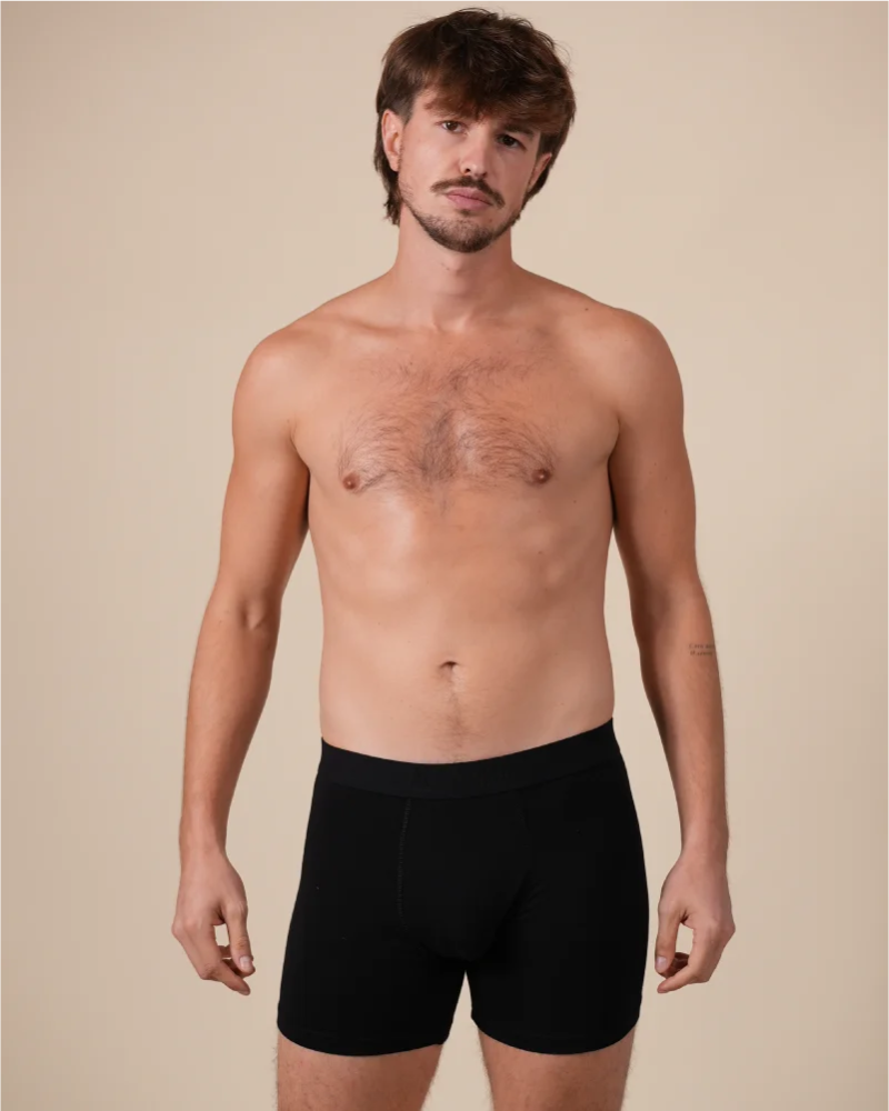 Full-length model wearing the Alan Red Bomber men's black boxer briefs