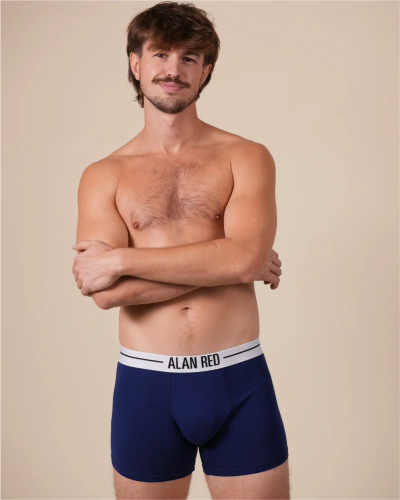 Model wearing Alan Red Lasting ultramarine blue boxer briefs, full front view with white branded waistband.