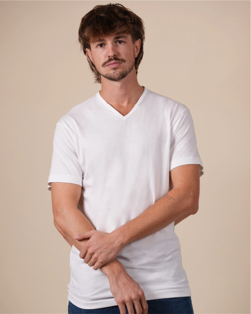 Alan Red Vermont men's white short-sleeve V-neck T-shirt, front view worn by model with crossed arms.